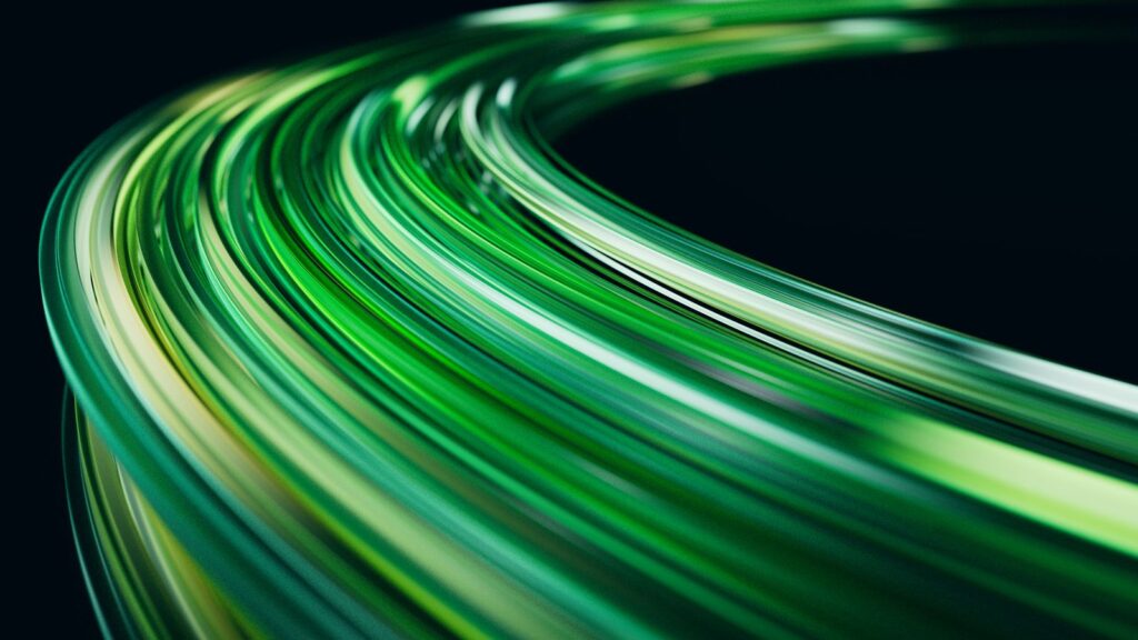 Abstract green light trails on a dark background